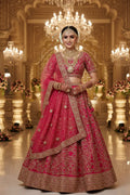 Indian bridal model wearing Lehenga Choli Set with gold embroidery and dupatta